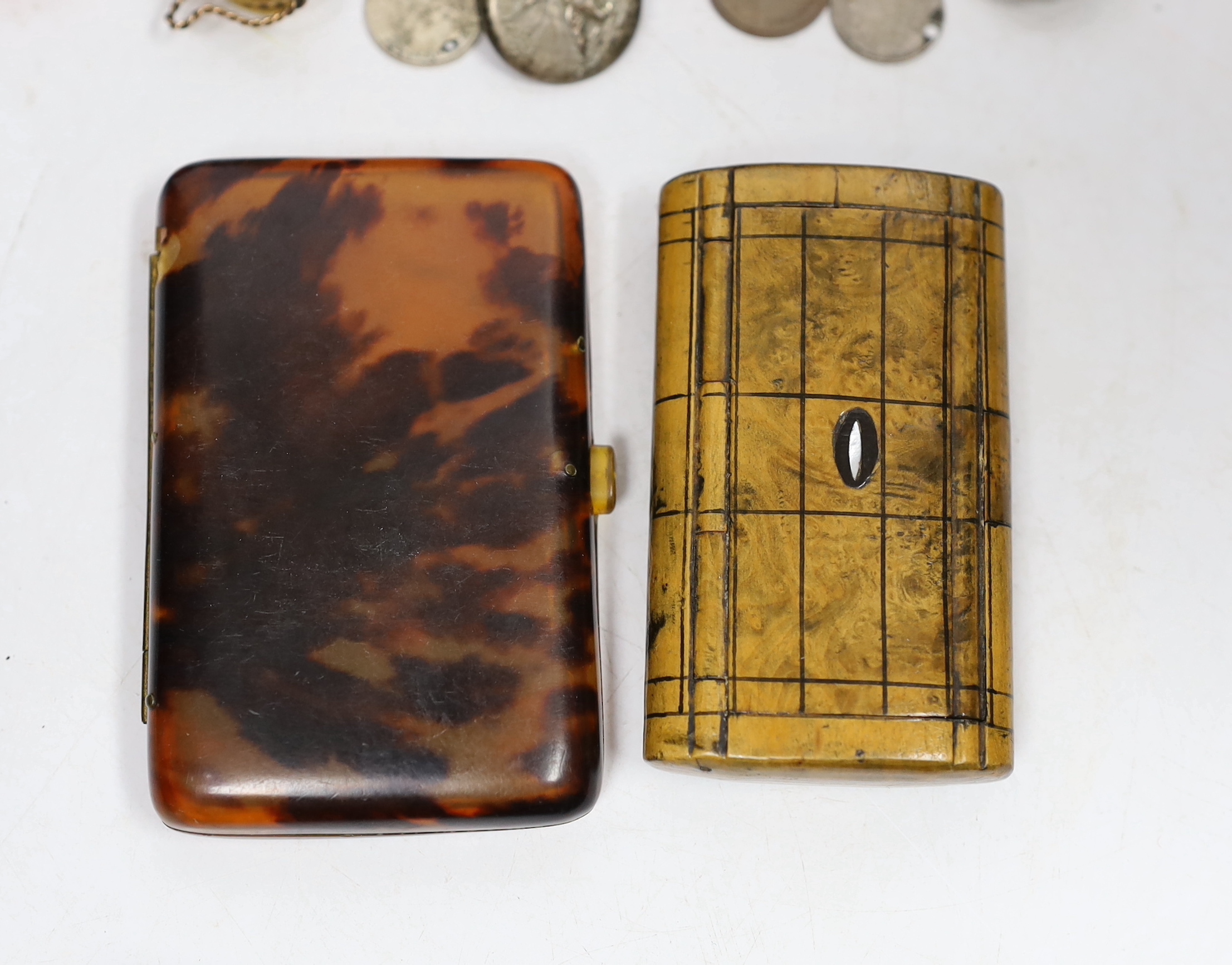 A group of vertu to include an unusual Victorian white metal mounted green glass combination scent bottle and whistle, a group of Art Nouveau silver buttons, carved tortoiseshell boxes, a double ended scent bottle etc.